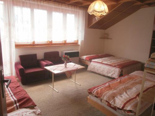 Un pat sau paturi într-o cameră la Vysoké Tatry - Svit