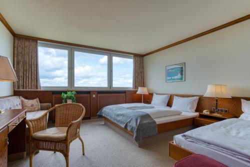 Postel nebo postele na pokoji v ubytování FF&E Hotel Dania