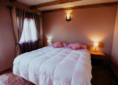Cama o camas de una habitación en Diablito Atacama Hostel