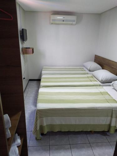 Ένα ή περισσότερα κρεβάτια σε δωμάτιο στο Hotel Campina Executivo