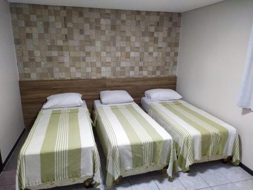 Ένα ή περισσότερα κρεβάτια σε δωμάτιο στο Hotel Campina Executivo