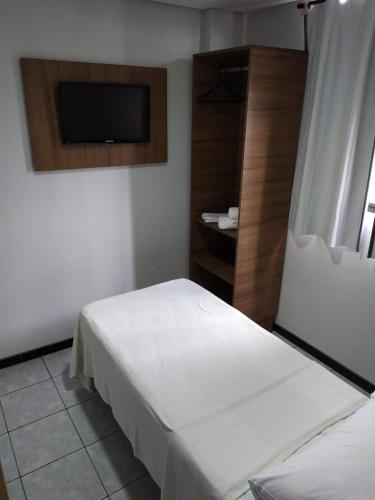 Ένα ή περισσότερα κρεβάτια σε δωμάτιο στο Hotel Campina Executivo