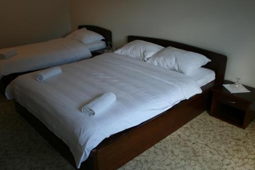 Ένα ή περισσότερα κρεβάτια σε δωμάτιο στο Motel Maksumić