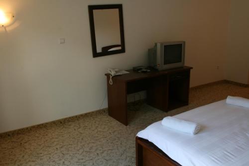 Ένα ή περισσότερα κρεβάτια σε δωμάτιο στο Motel Maksumić