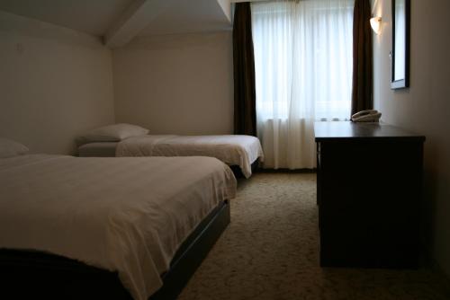 Ένα ή περισσότερα κρεβάτια σε δωμάτιο στο Motel Maksumić