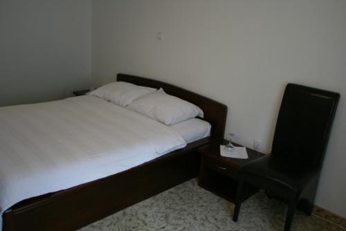 Ένα ή περισσότερα κρεβάτια σε δωμάτιο στο Motel Maksumić