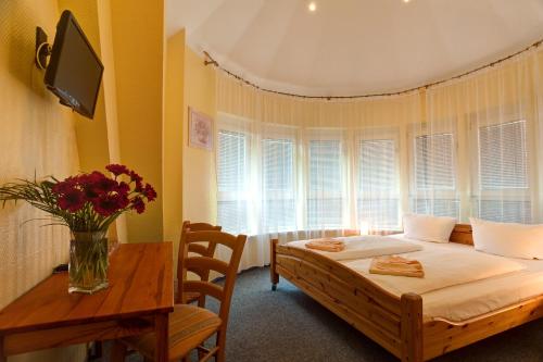 Ένα ή περισσότερα κρεβάτια σε δωμάτιο στο Hotel Atlantic