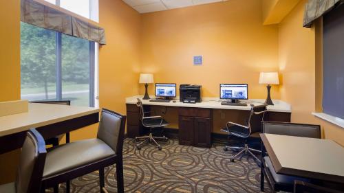 an office with two computers on a desk with chairs at Best Western Plus Coldwater Hotel in Coldwater