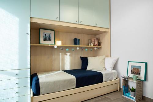 En eller flere senge i et værelse på Quality Apartment Parisina