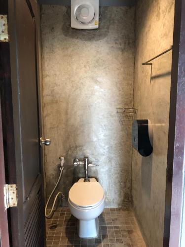 a bathroom with a toilet in a stall at Aonang Sunset Hotel - SHA Extra Plus in Ao Nang Beach