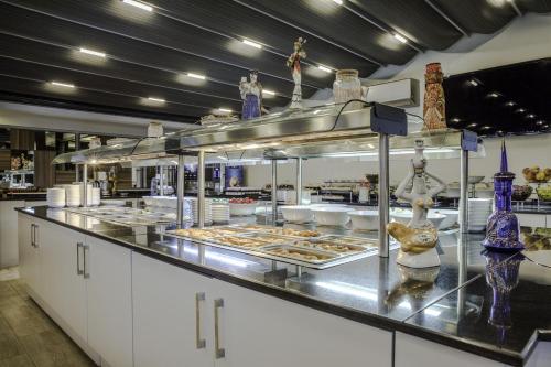 a restaurant kitchen with a buffet of food at Hotel Venera Istanbul Old City in Istanbul