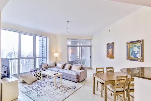 a living room with a couch and a table at 2BR High Floor Torch Tower Dubai Marina in Dubai