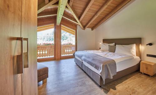 Ένα ή περισσότερα κρεβάτια σε δωμάτιο στο Chalet Fuchsbau