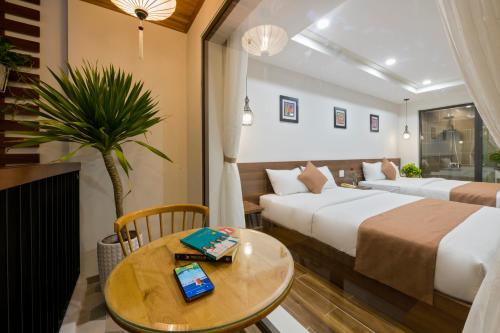 Postel nebo postele na pokoji v ubytování Brother Villa Hoi An