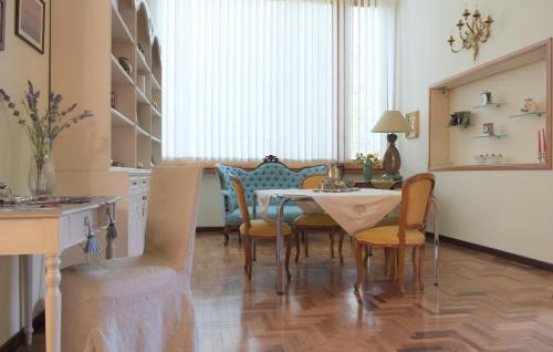 a kitchen and dining room with a table and chairs at Villa dei Gelsomini, Residenza nel verde in Viterbo