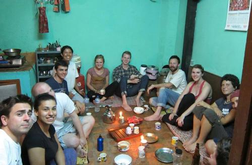 a group of people sitting on a couch at Sanu House in Pātan