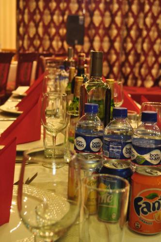 a table with bottles of alcohol and glasses on it at Platinum Hotel Ulaanbaatar in Ulaanbaatar