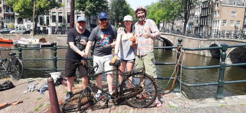 a group of people standing next to a bike at BEAUTIFUL APARTMENT WiTH ASIAN STYLE BEDROOM NEAR RAI & CENTER in Amsterdam