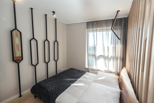 Posteľ alebo postele v izbe v ubytovaní D Apartments Centrum Jurowiecka