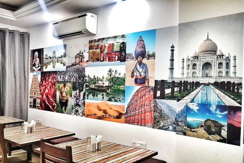 a wall with many pictures of monuments on it at Hotel Aerocity Purple Orchid in New Delhi