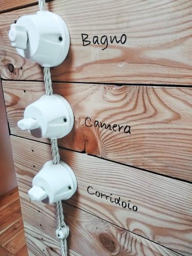 a wooden box with a phone hanging on it at tenuta i musi lunghi in Lesignano deʼ Bagni