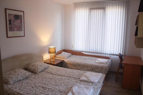 Postel nebo postele na pokoji v ubytování Central Square Apartment