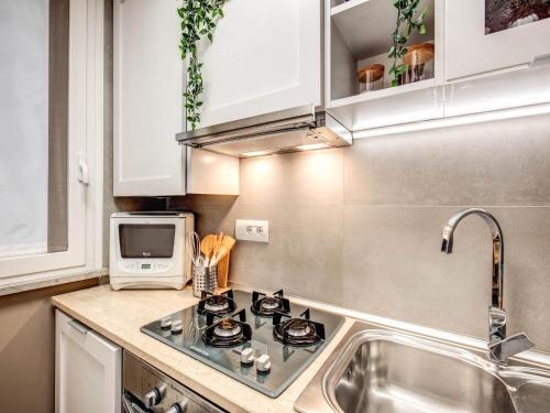 Kuchyň nebo kuchyňský kout v ubytování Residenza Paola - 2BR Trastevere