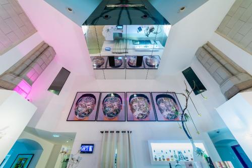 a view from above of a room with plates on the wall at SOZO Hotel in Nantes