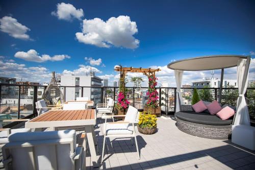 a balcony with a gazebo and a table and chairs at SOLA HOTEL in Tokyo