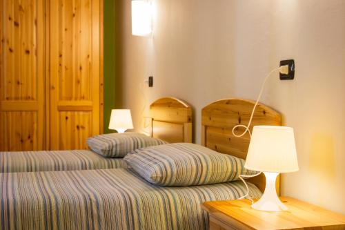 Ένα ή περισσότερα κρεβάτια σε δωμάτιο στο Albergo Ristorante Cuccini