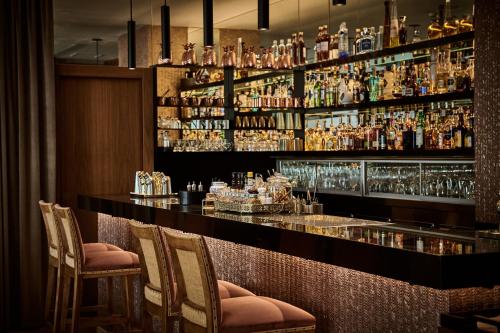 
a bar with a lot of drinks on it at Es Princep - The Leading Hotels of the World in Palma de Mallorca
