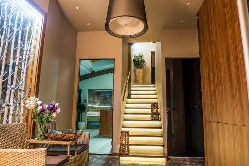 a hallway with stairs leading to a house at Apartments Marconio Wellness Club in Belgrade