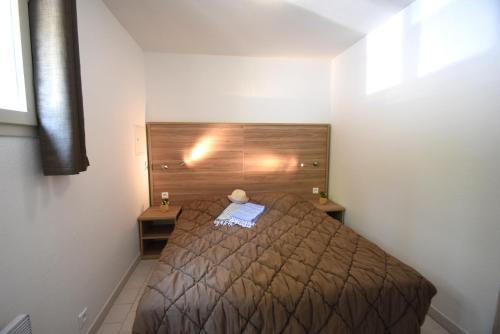 Ένα ή περισσότερα κρεβάτια σε δωμάτιο στο Residence La Palmeraie