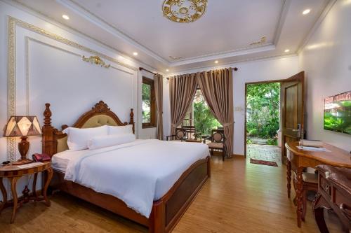 Postel nebo postele na pokoji v ubytování Coco Palm Beach Resort