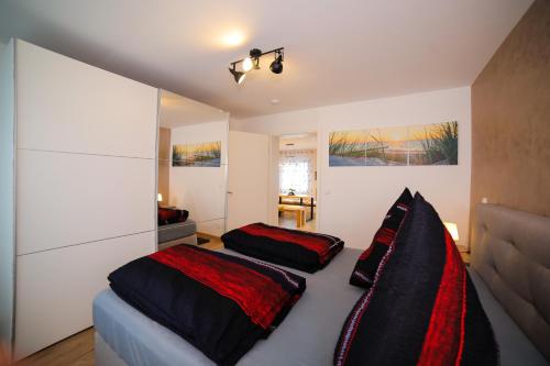 a bedroom with a bed with two pillows on it at Apartment Claudia in Sinsheim