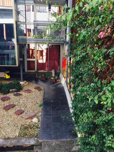 a hallway of a building with a ivy covered wall at Bella 269 Guest house in Santiago