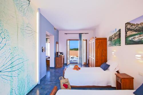 A bed or beds in a room at Suvaki Resort