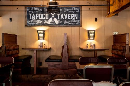 a bar with a sign that reads tar protocol tavern at Historic Tapoco Lodge Resort in Tapoco