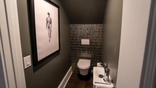 a small bathroom with a sink and a toilet at Stonehurst Place Bed & Breakfast in Atlanta