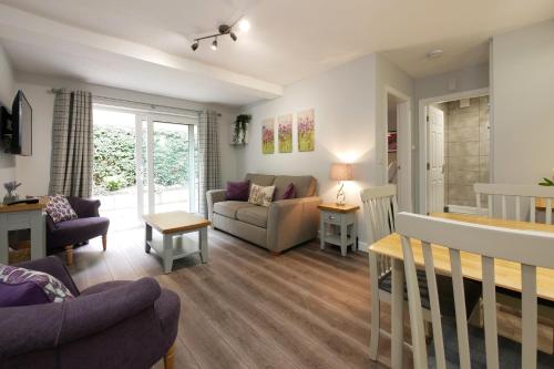 a living room with a couch and a table at Crewe Short Lets 4 Victoria Court, Crewe in Crewe