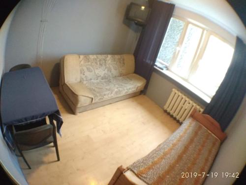 an overhead view of a living room with a couch and window at 1050 Śmiałego 36 - Tanie Pokoje - samodzielne zameldowanie - self check in in Poznań
