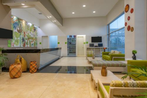 a living room with couches and a lobby at Mia Hotel Choco in Quibdó