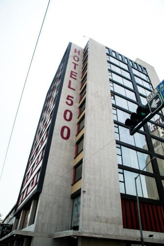 a building with a sign that reads hotel at Booking 500 in Monterrey