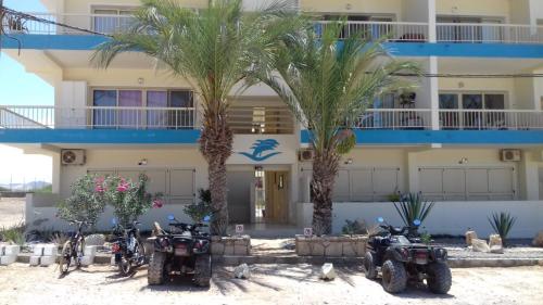 a group of motorcycles parked in front of a building at S4A Trilocale vista Mare in Sal Rei