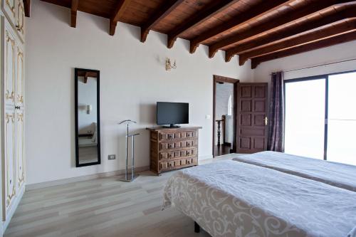 Tempat tidur dalam kamar di Casa Las Rocas