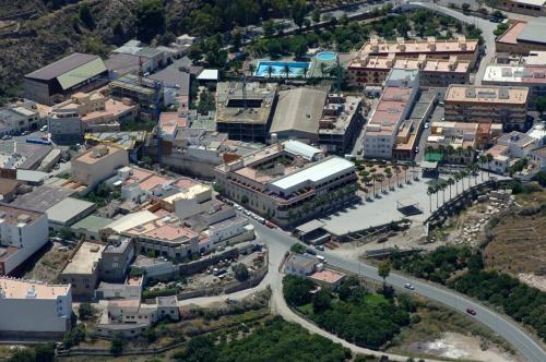 an overhead view of a city with a road and buildings at Balneario San Nicolas in Alhama de Almería