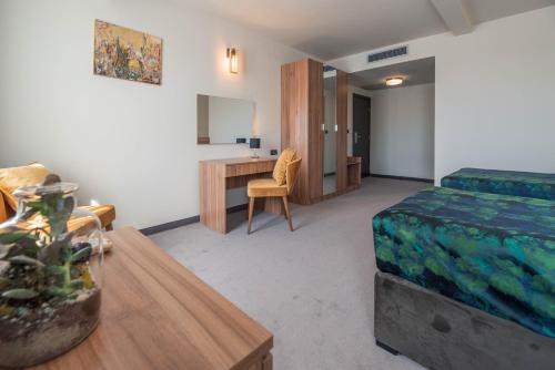 Postel nebo postele na pokoji v ubytování Hotel Aloha
