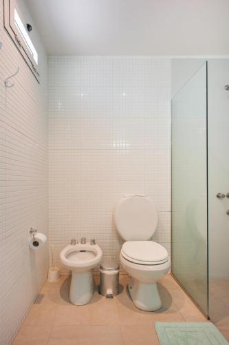 a bathroom with a toilet and a bidet at Soho Point Central in Buenos Aires