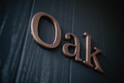 a wooden sign that says ego on a table at Bowburn Hall Hotel in Durham