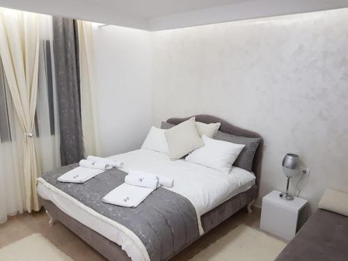 Ένα ή περισσότερα κρεβάτια σε δωμάτιο στο Kopaonik Superior Lux Apartman